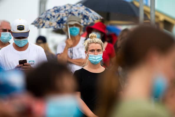 People are seen lining up at a Covid-19 testing site at Mona Vale Hospital on Dec. 18, 2020 in Sydney, Australia.
