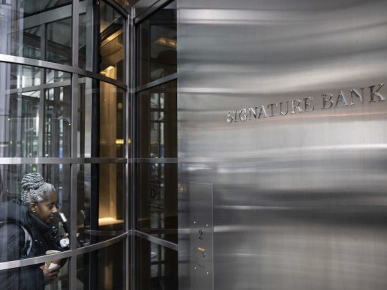 A person enters the Signature Bank headquarters in New York, Monday, March 13, 2023. President Joe Biden is telling Americans that the nation’s financial systems are sound. This comes after the swift and stunning collapse of two banks that prompted fears of a broader upheaval. (AP Photo/Yuki Iwamura)